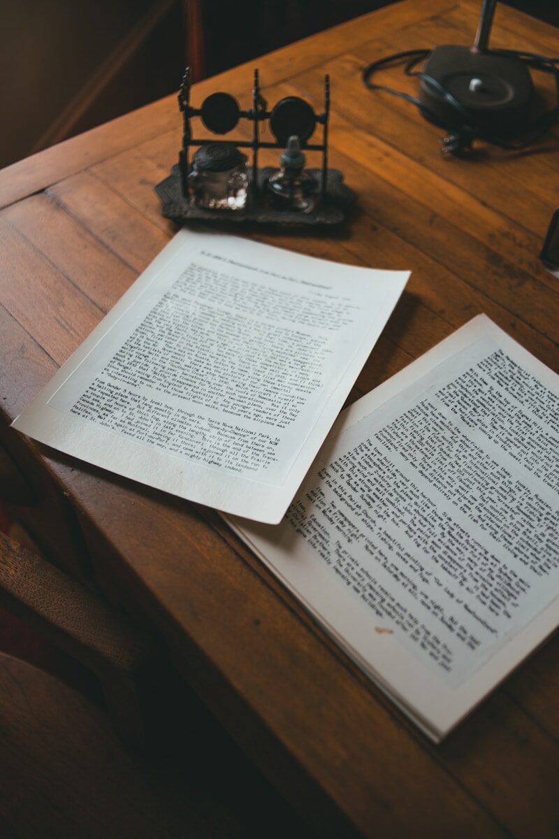 white printer paper on brown wooden table