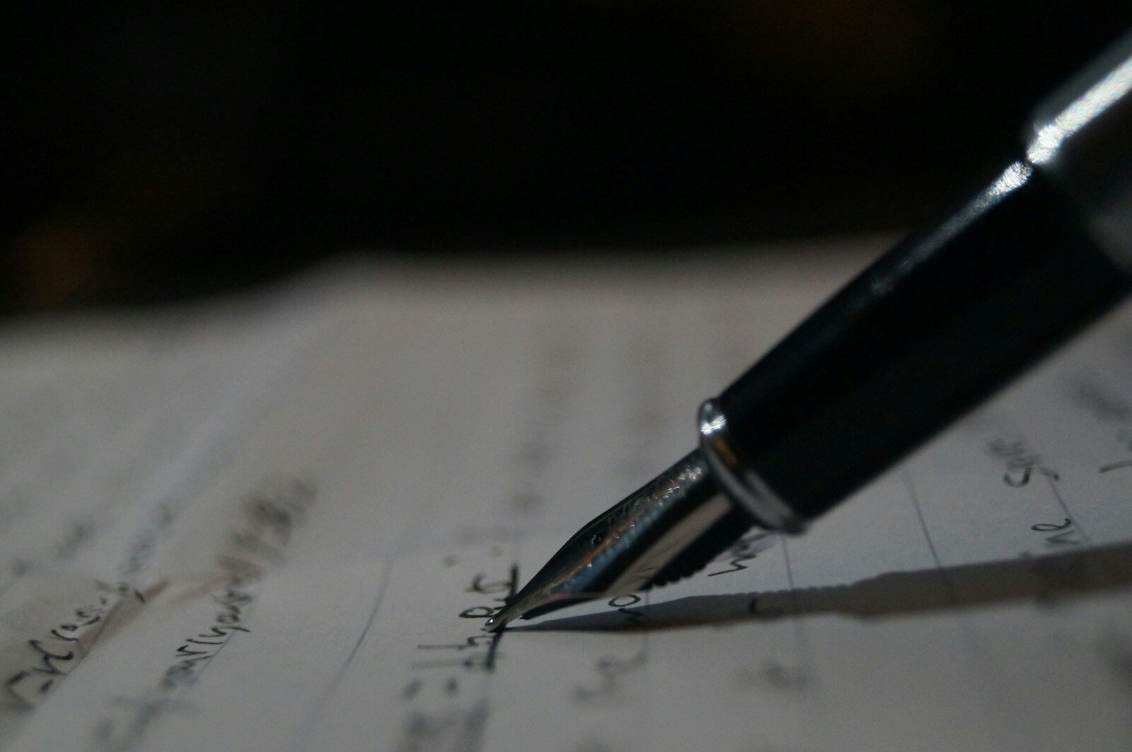 a pen is sitting on top of a piece of paper